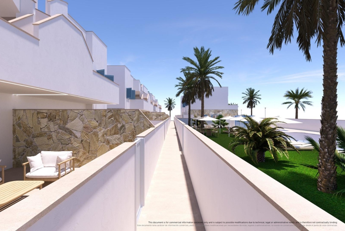NEW-BUILD-RESIDENTIAL-COMPLEX-IN-TORRE-DE-LA-HORADADA-7 Sun-drenched outdoor terrace and landscaped garden with palm trees at the new build 3-bedroom top floor apartment in Torre de la Horadada.