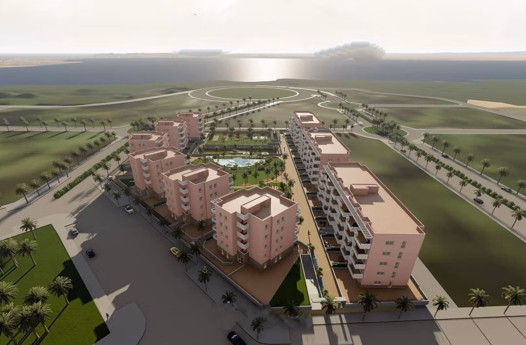 Sun-drenched modern penthouse complex with landscaped gardens and pool, offering panoramic coastal views in El Raso, Guardamar del Segura.