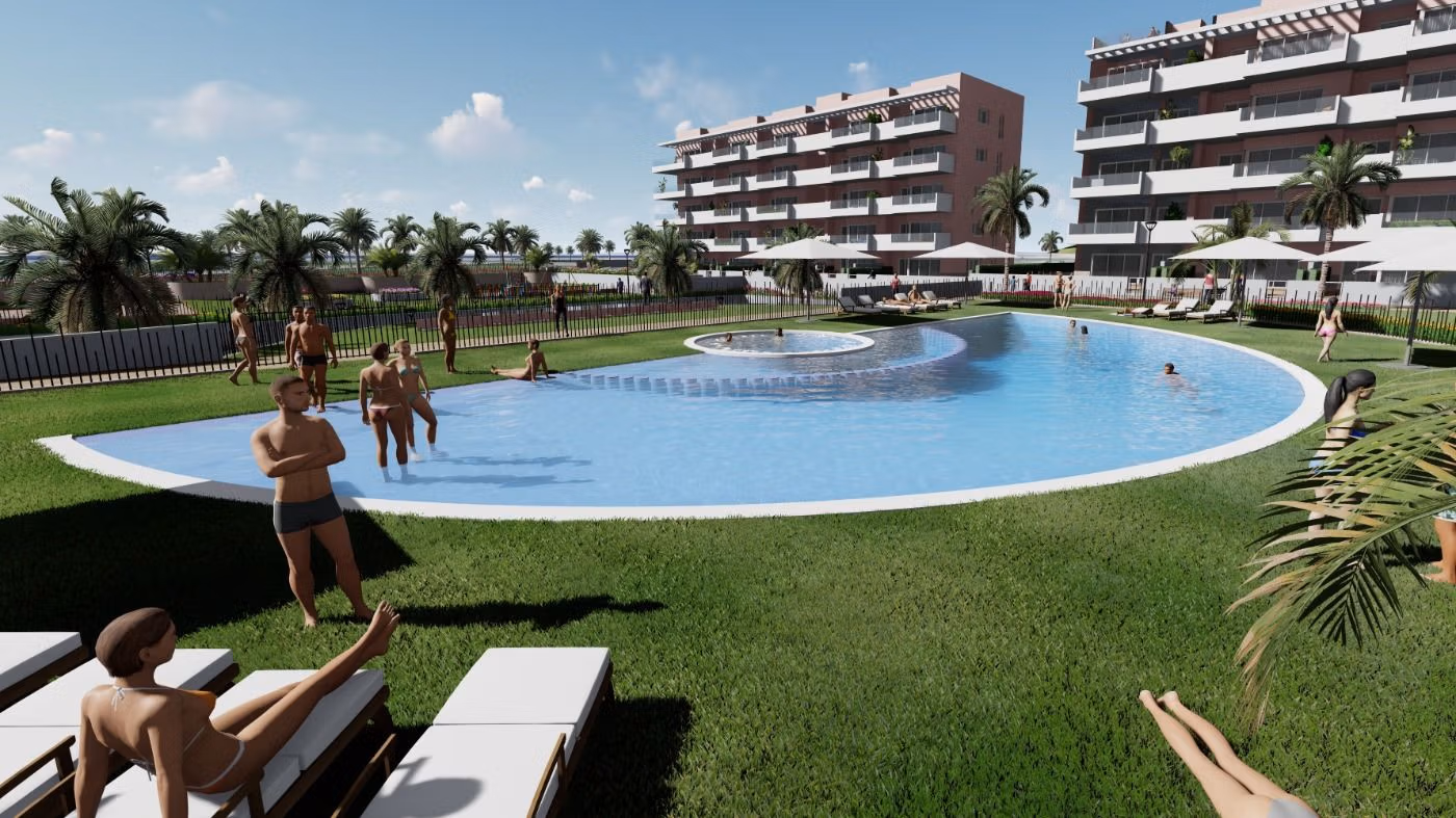 Sun-drenched communal pool with lush landscaped gardens surrounding a modern 3-bedroom ground floor apartment in El Raso, Guardamar del Segura.