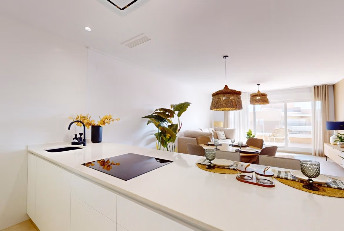 Bright modern open-plan kitchen and living area with elegant decor in luminous 3 bedroom penthouse in El Raso, Guardamar del Segura.