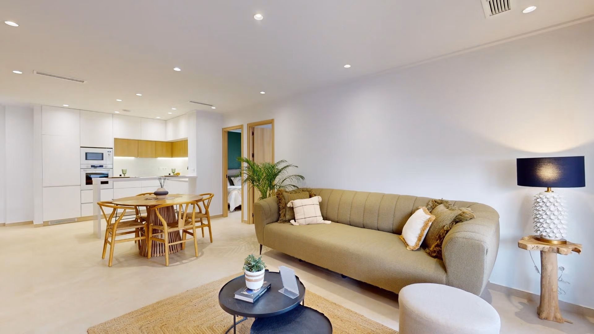 Bright, modern open-plan living area in a new 3-bedroom ground floor apartment with private garden in El Raso, Guardamar del Segura.
