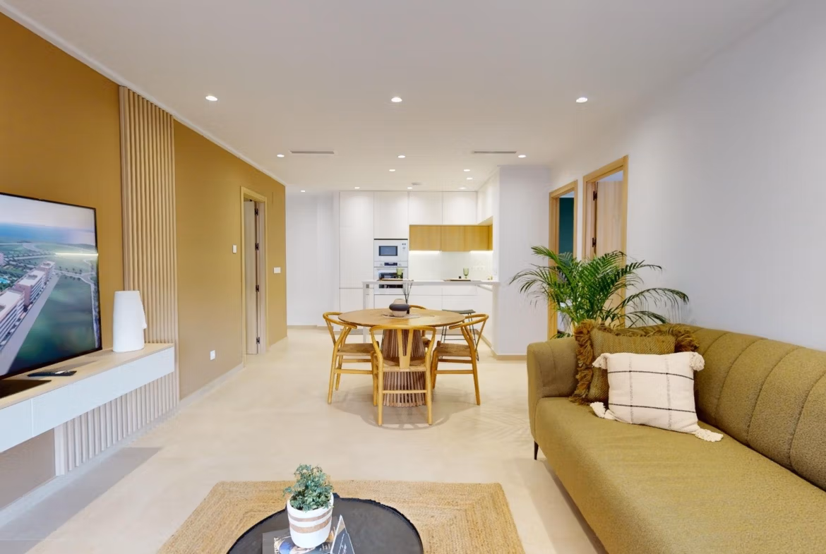 Bright open-plan living and dining area in modern 3-bedroom ground floor apartment with private garden in El Raso, Guardamar del Segura.