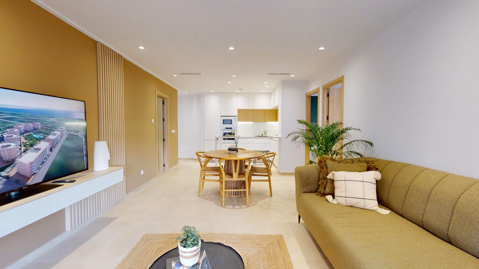 Bright open-plan living and dining area in modern 3-bedroom ground floor apartment with private garden in El Raso, Guardamar del Segura.