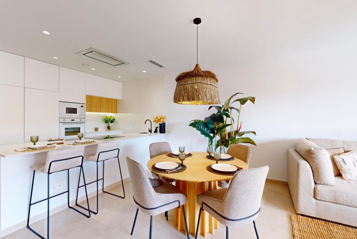 Bright modern open-plan kitchen and dining area in luminous 3-bedroom penthouse with solarium in El Raso, Guardamar del Segura.