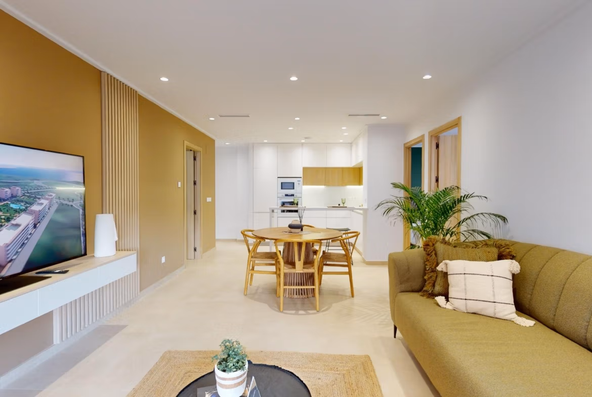 Bright, modern open-plan living and dining area in a new 3-bedroom ground floor apartment with private garden in El Raso, Guardamar del Segura.
