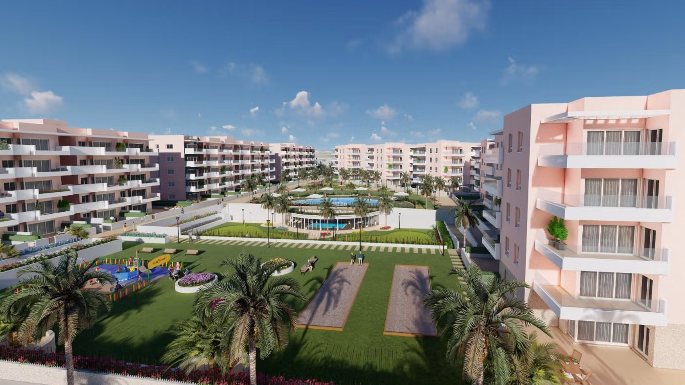 Modern luxury apartment complex with landscaped gardens and palm trees in El Raso, Guardamar del Segura ground floor 3-bedroom listing.