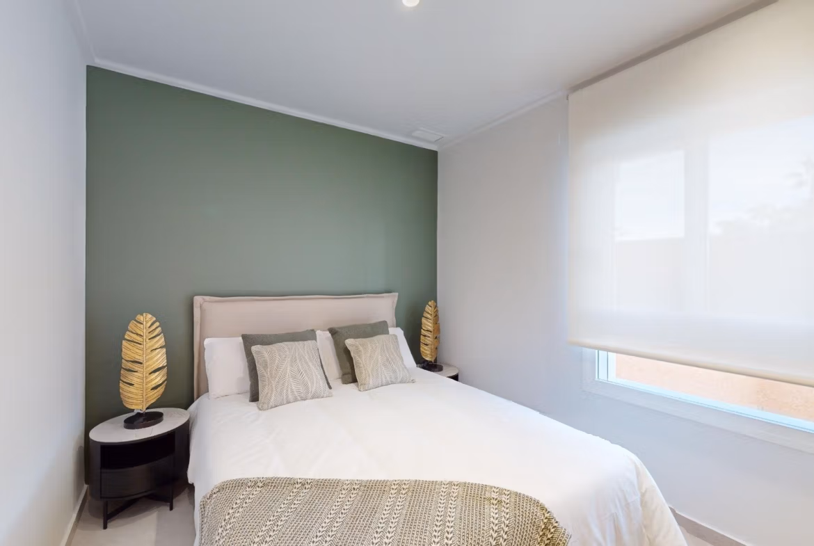 Bright, elegant bedroom in a new build 3-bedroom ground floor apartment with private garden in El Raso, Guardamar del Segura.