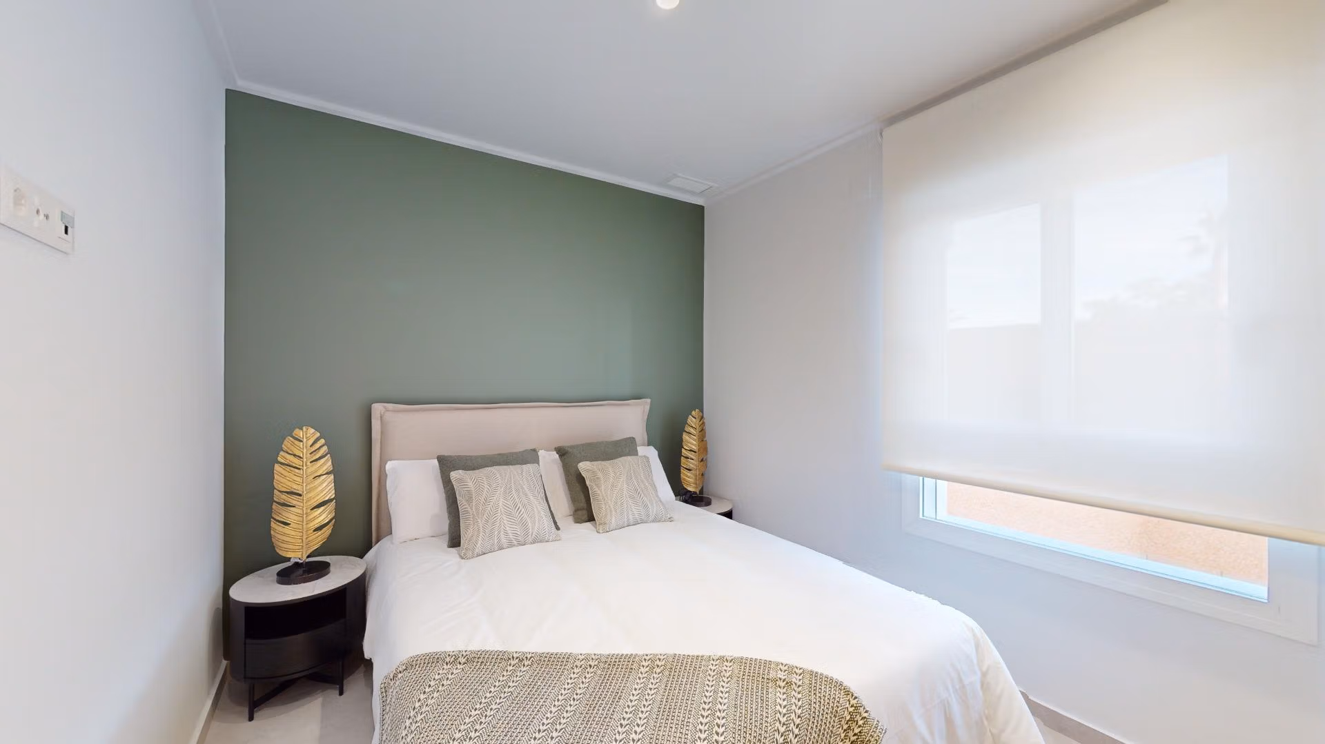 Bright, elegant bedroom in a new build 3-bedroom ground floor apartment with private garden in El Raso, Guardamar del Segura.