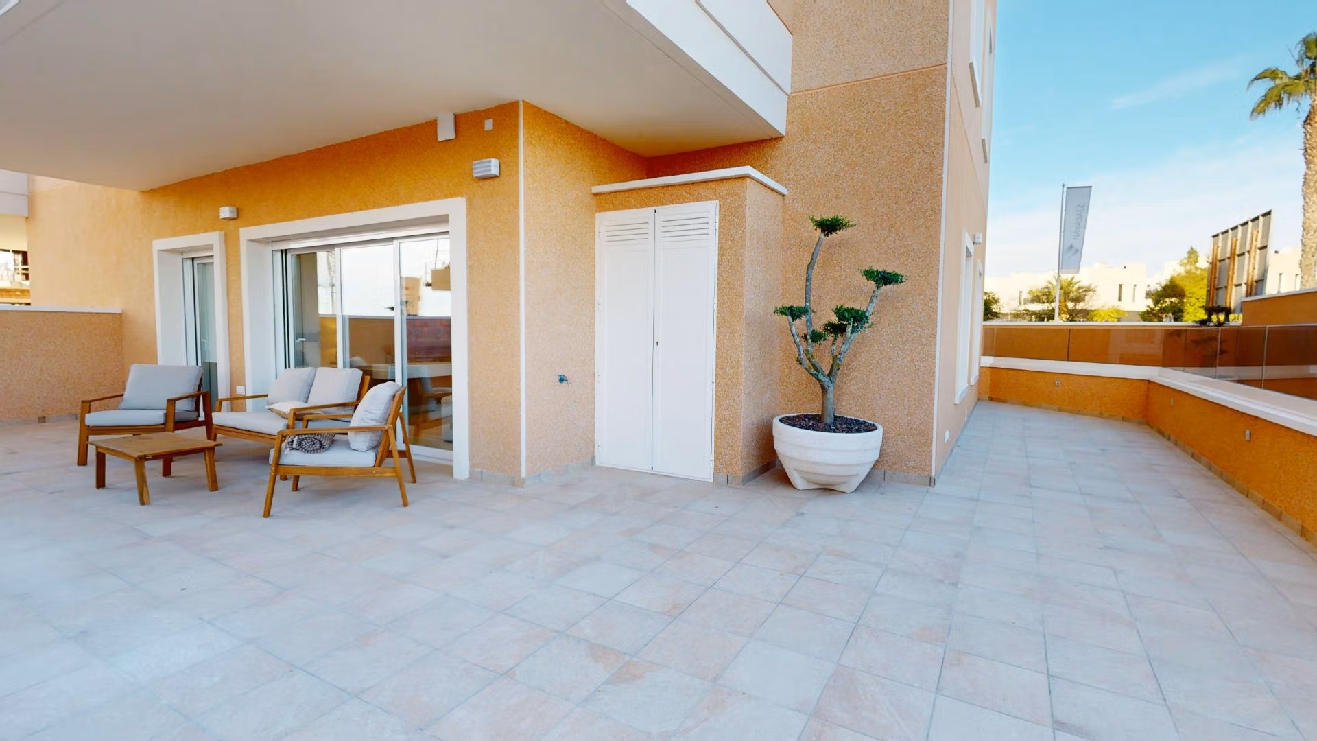 Spacious sunlit terrace with modern outdoor seating at a 3-bedroom ground floor apartment in El Raso, Guardamar del Segura.