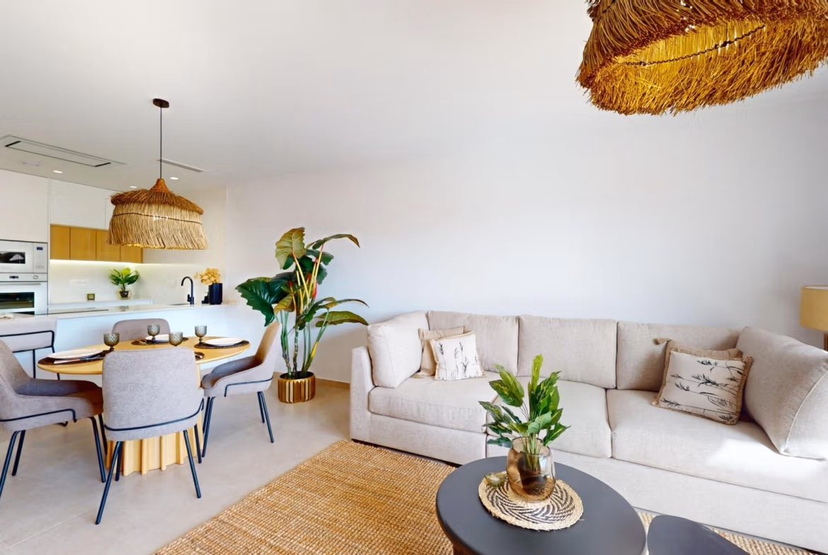 Bright open-plan living and dining area with modern kitchen in luminous 3-bedroom penthouse in El Raso, Guardamar del Segura.