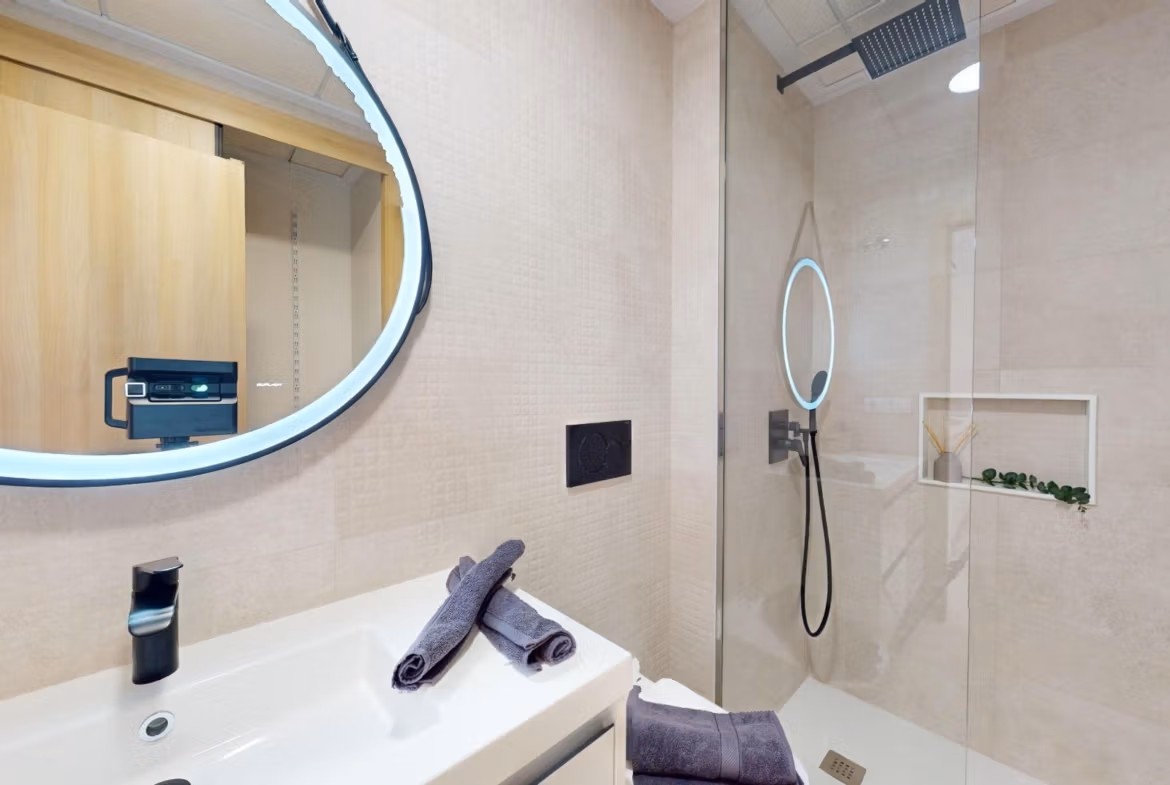 Modern, sleek bathroom with illuminated mirror and walk-in shower in luminous 3-bedroom penthouse, El Raso, Guardamar del Segura