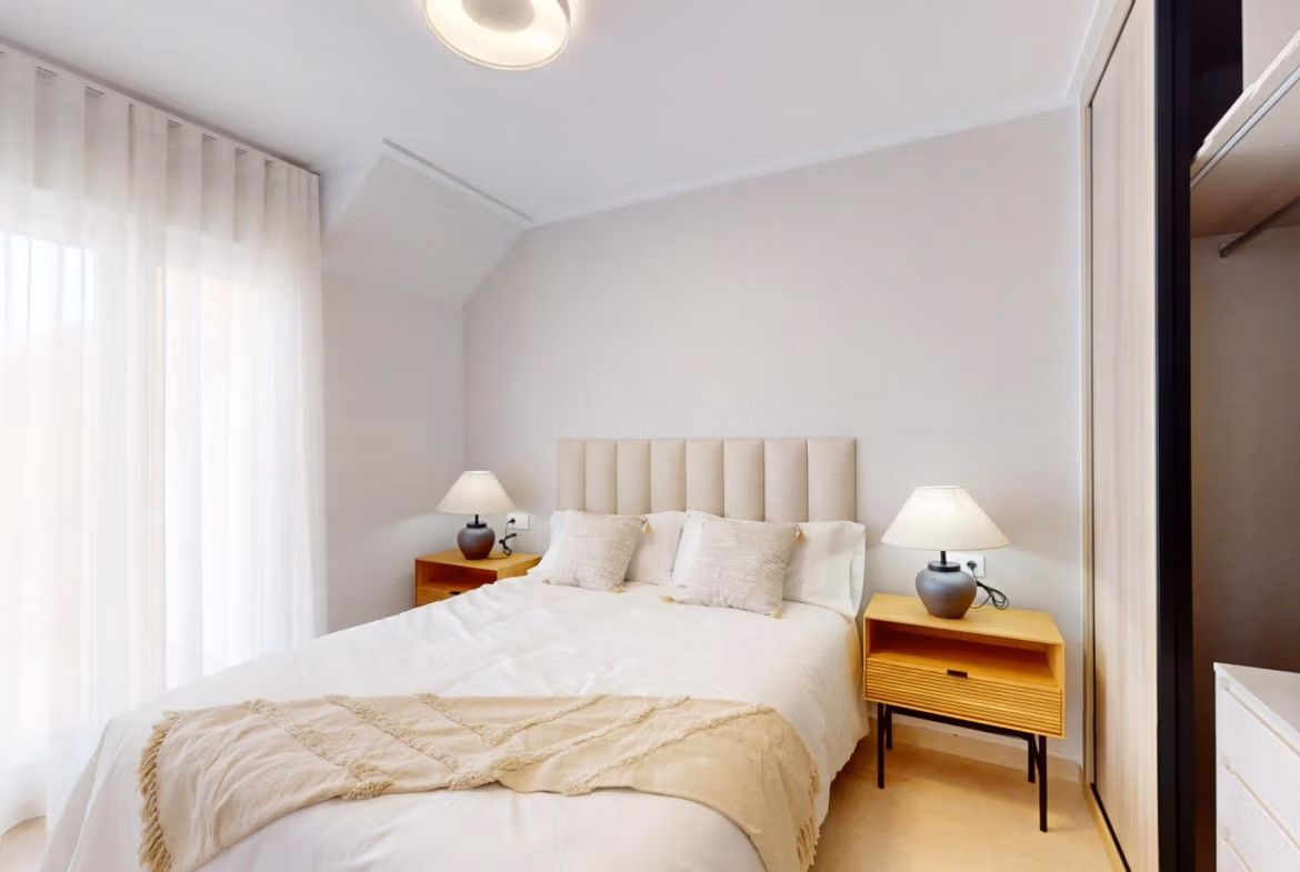 Bright, serene bedroom in a luminous 3-bedroom penthouse with soft natural light in El Raso, Guardamar del Segura.