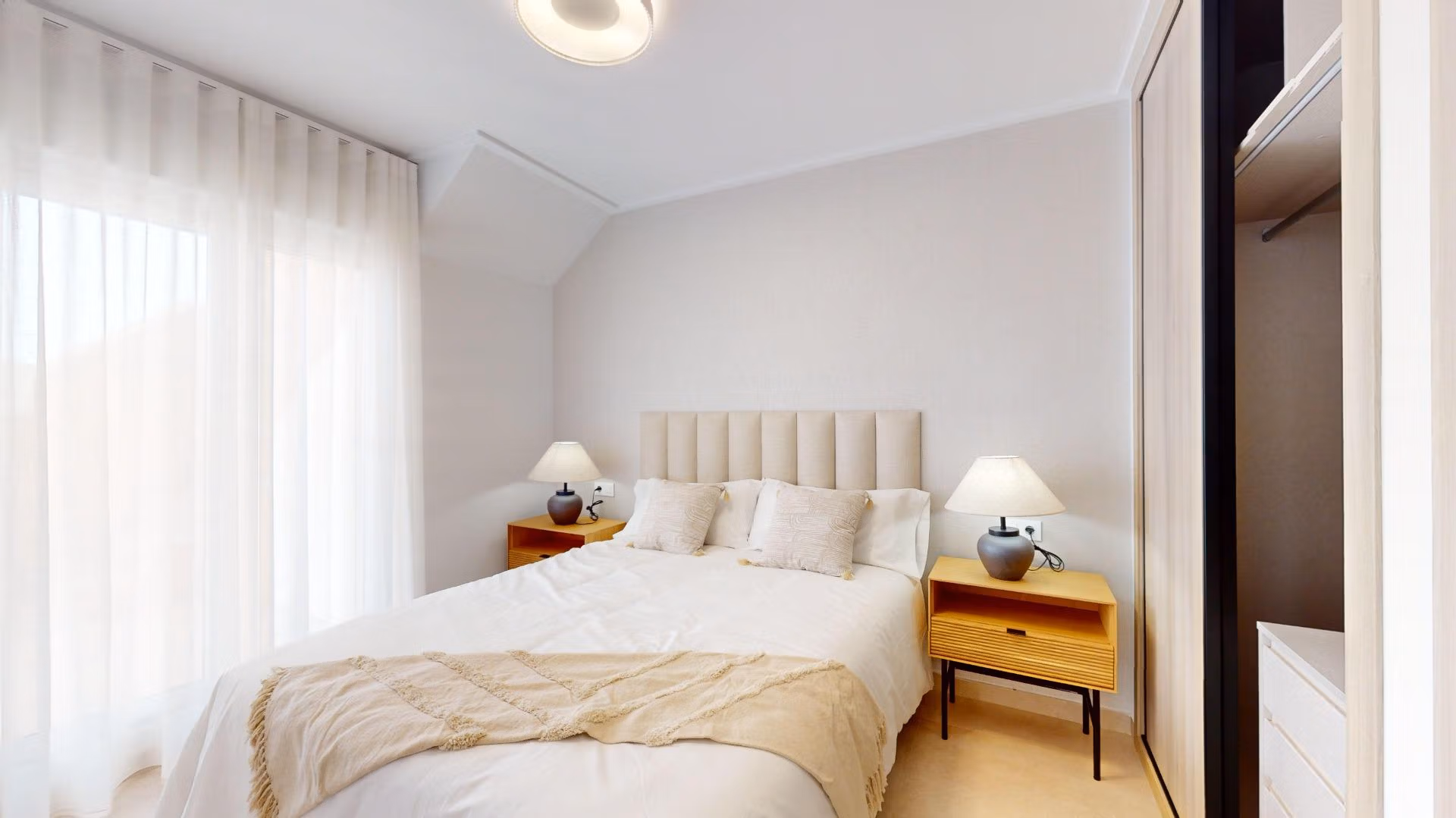 Bright, serene bedroom in a luminous 3-bedroom penthouse with soft natural light in El Raso, Guardamar del Segura.