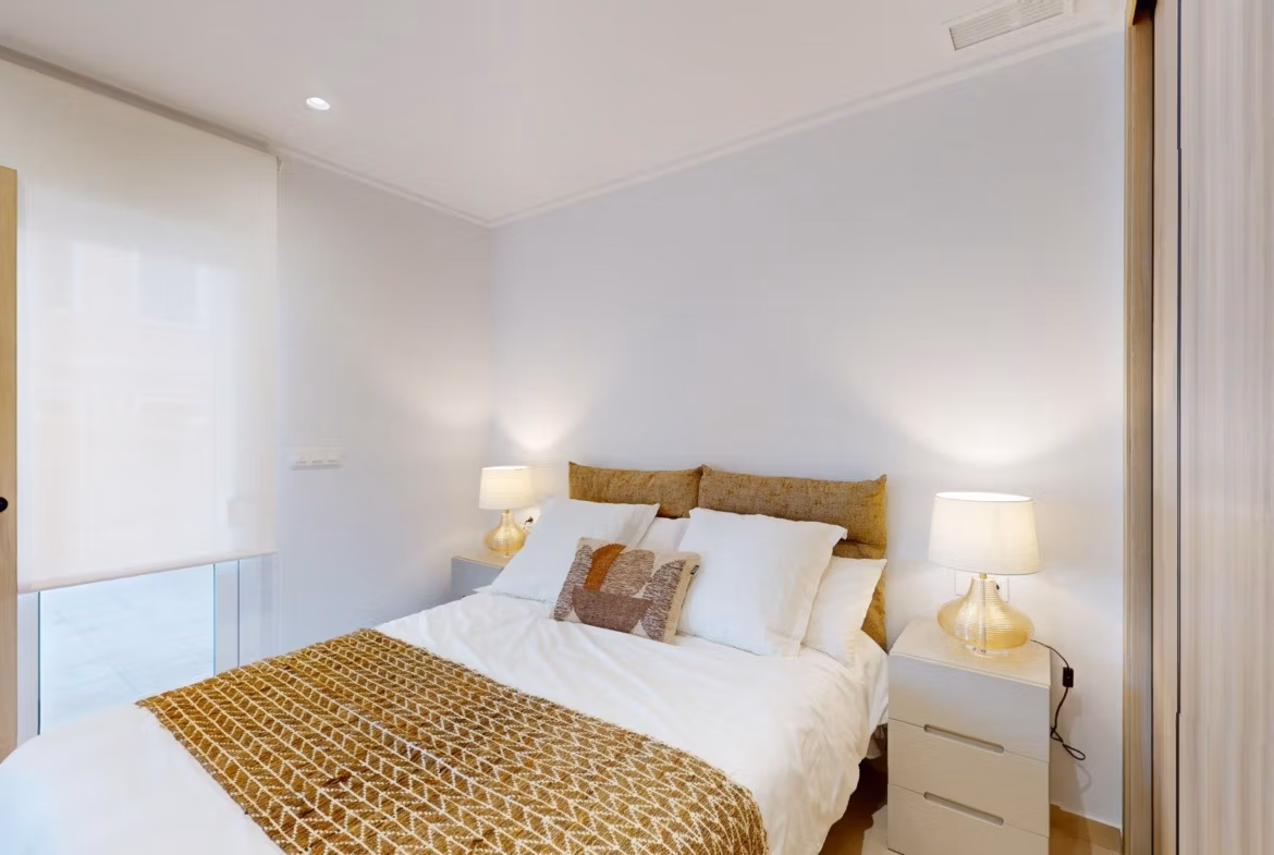 Bright and elegant bedroom in a new 3-bedroom ground floor apartment with modern decor in El Raso, Guardamar del Segura.