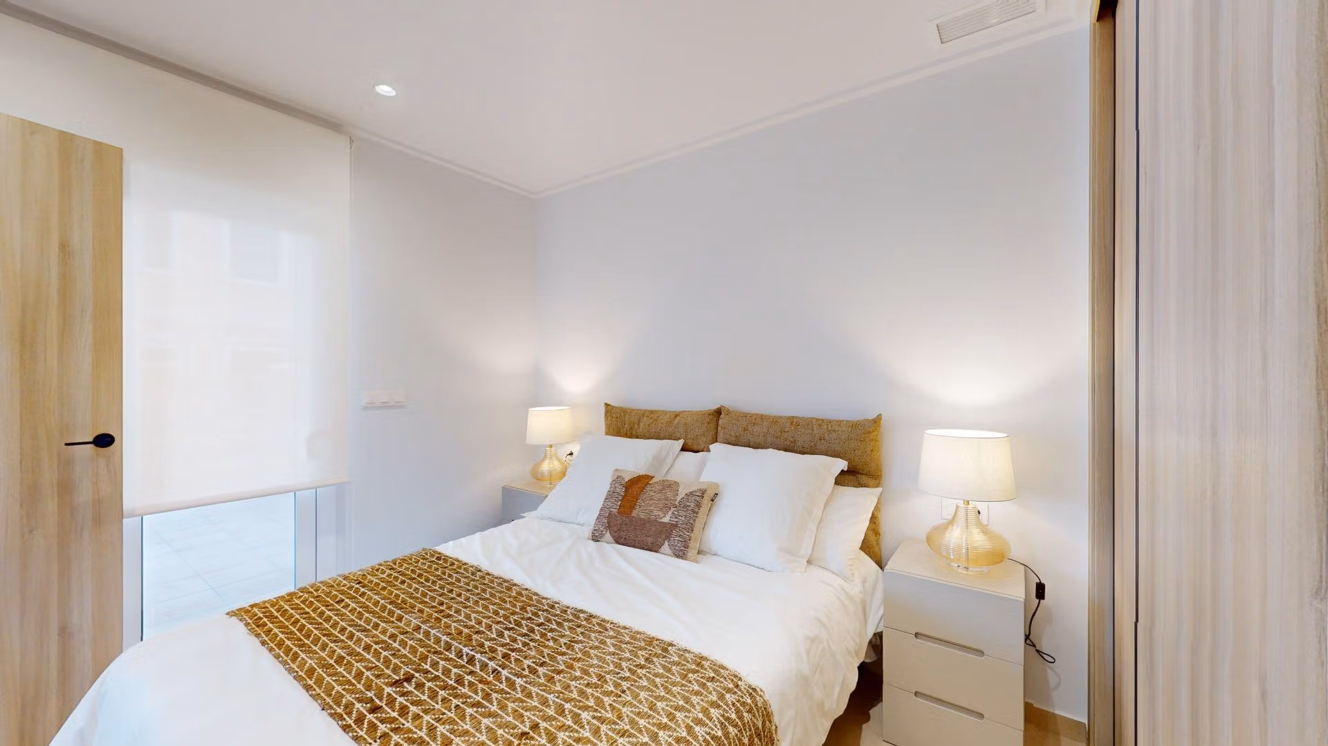 Bright and elegant bedroom in a new 3-bedroom ground floor apartment with modern decor in El Raso, Guardamar del Segura.