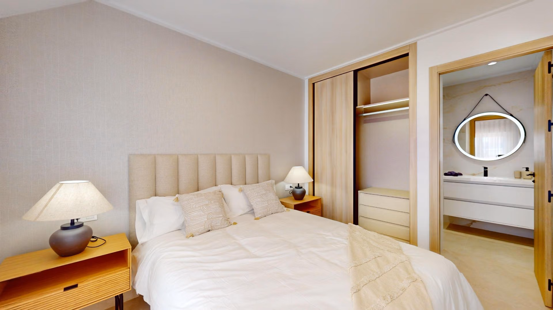 Bright and elegant 3-bedroom penthouse bedroom with modern en-suite and sleek wooden closet in El Raso, Guardamar del Segura.