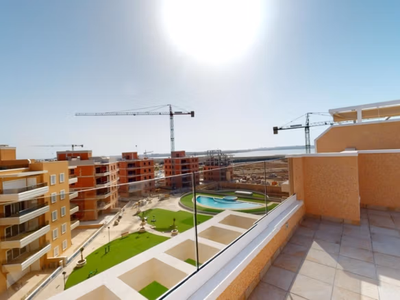 Sun-drenched spacious terrace with glass balustrade in luminous 3-bedroom penthouse with solarium, El Raso, Guardamar del Segura