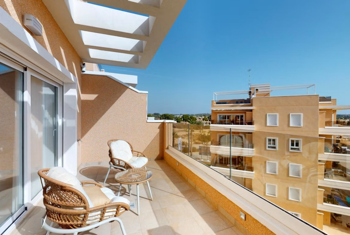 Bright sun-drenched terrace with cozy seating in a luminous 3-bedroom penthouse with solarium in El Raso, Guardamar del Segura.