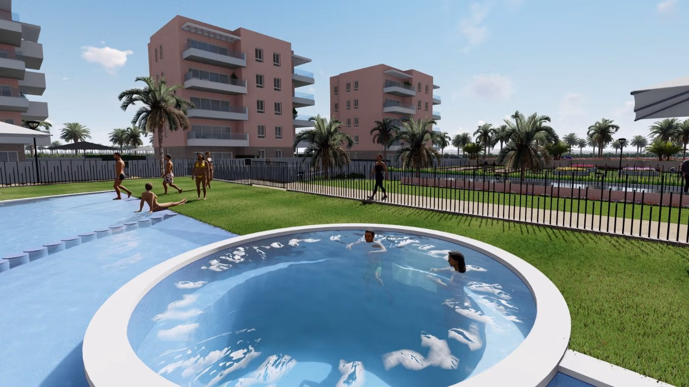 Sun-drenched communal pool and landscaped garden area in luxury 3 bedroom penthouse complex in El Raso, Guardamar del Segura.