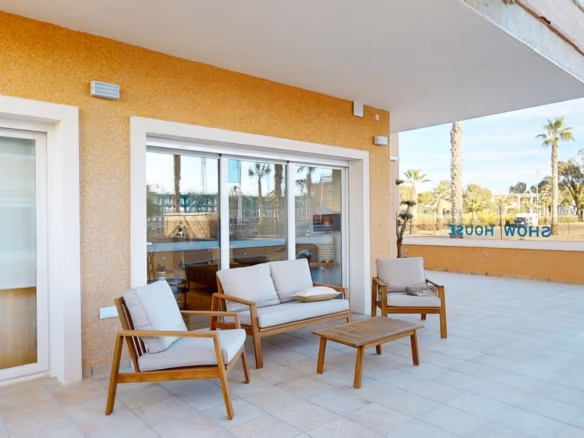 Spacious sun-drenched terrace with modern outdoor seating in a new 3-bedroom ground floor apartment in El Raso, Guardamar del Segura.