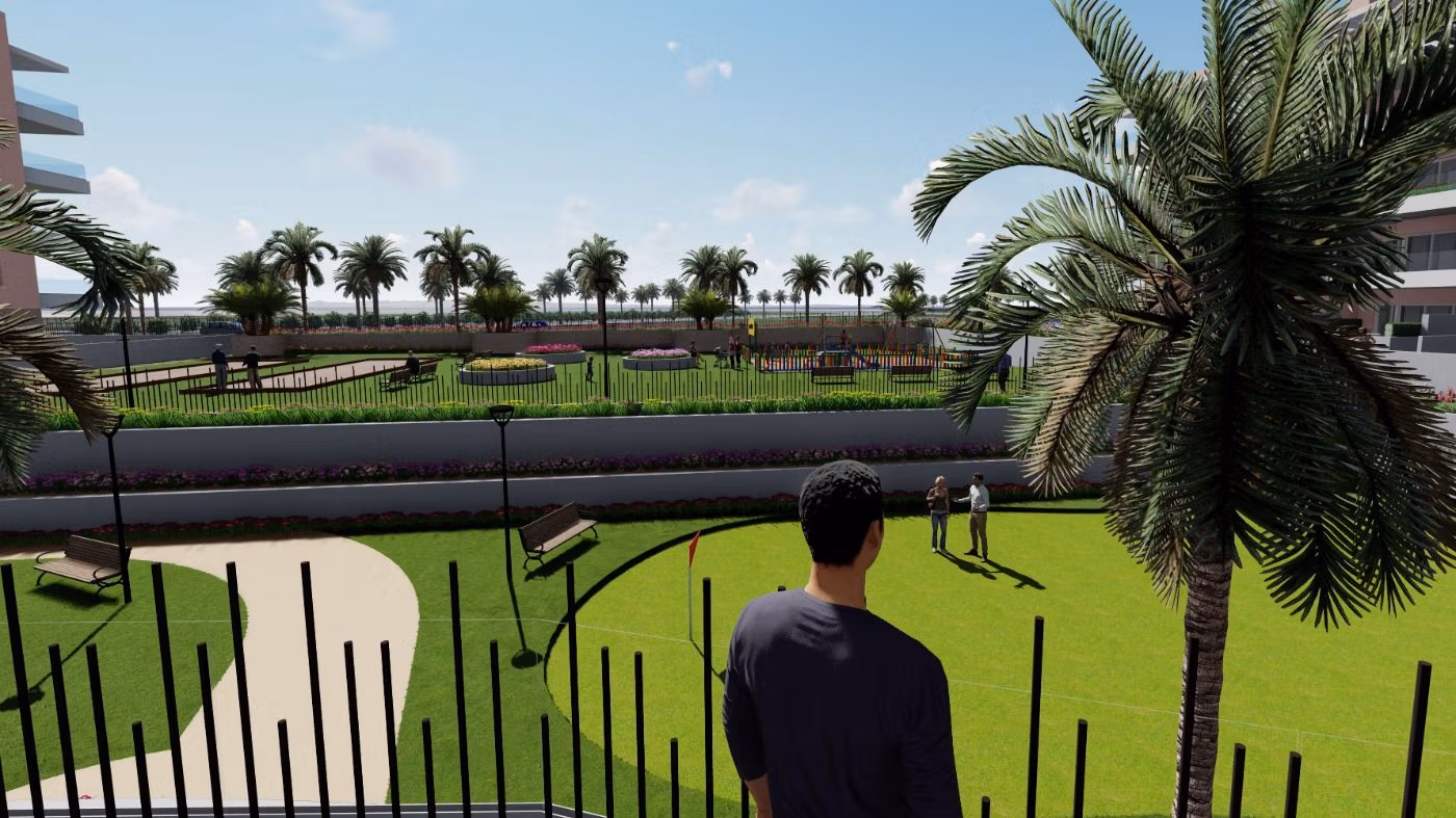 Lush landscaped communal garden with palm trees and modern seating in El Raso ground floor apartment complex, Guardamar del Segura.