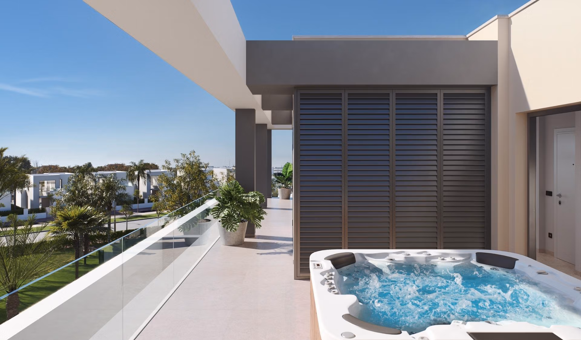 NEW-BUILD-RESIDENTIAL-IN-PRIVATE-GATED-RESORT-IN-PROVINCE-OF-MURCIA-2 Sun-drenched penthouse solarium with bubbling jacuzzi, glass railing, and lush greenery at Santa Rosalía Lake and Life Resort