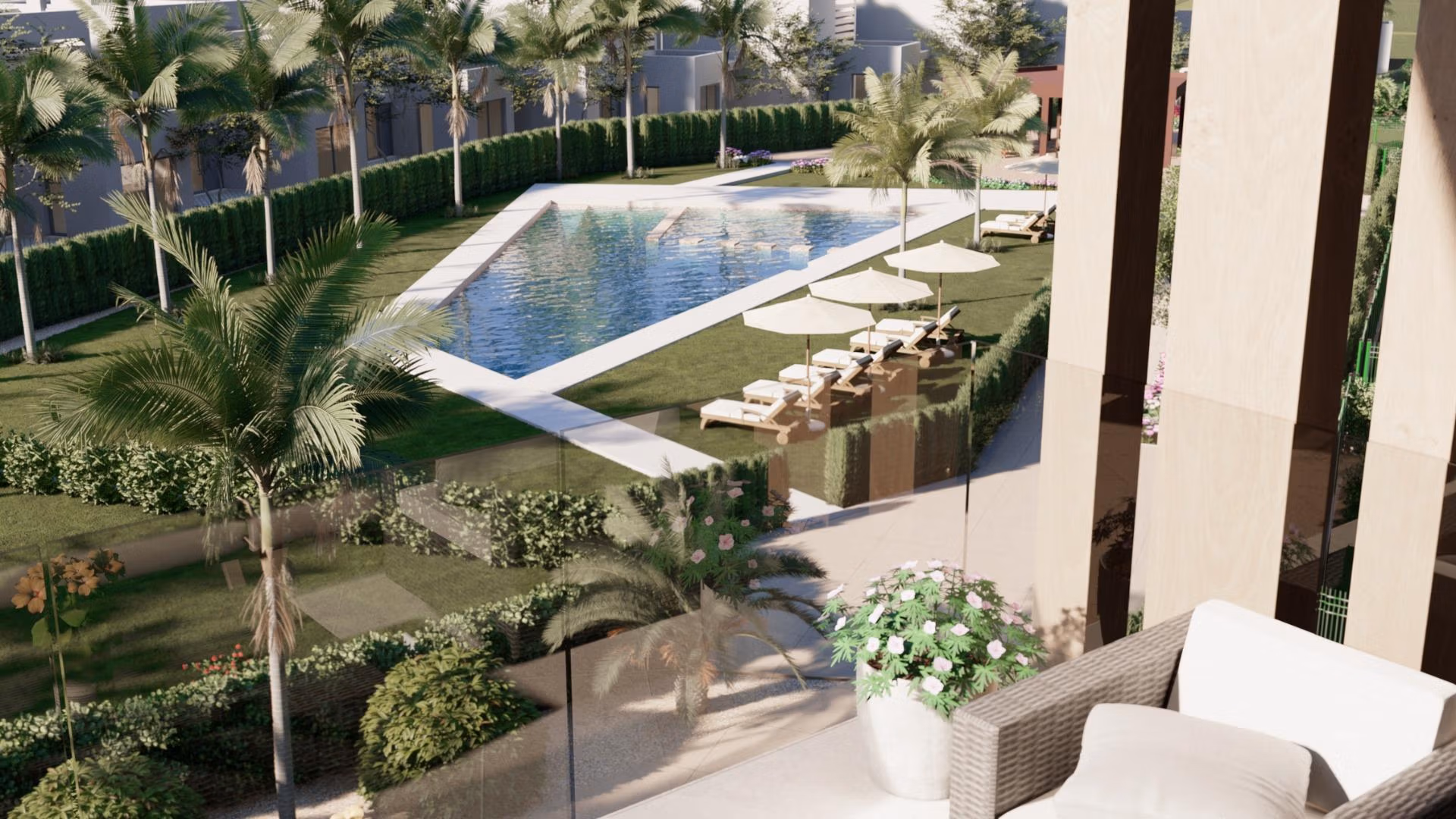 NEW-BUILD-RESIDENTIAL-IN-PRIVATE-GATED-RESORT-IN-PROVINCE-OF-MURCIA-4 Sun-drenched terrace with modern outdoor seating overlooking a landscaped pool at the 3-bedroom penthouse in Santa Rosalía Lake and Life Resort.