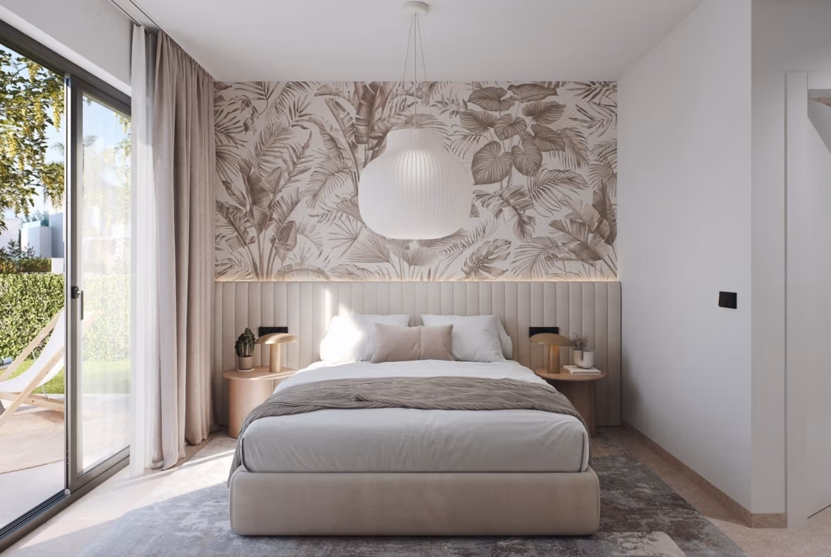 Bright, elegant bedroom with large glass doors opening to a lush terrace in a 3-bedroom penthouse at Santa Rosalía Lake and Life Resort.