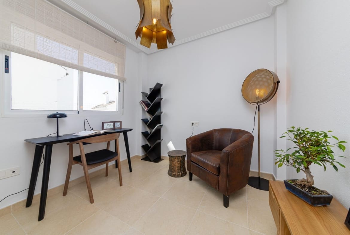 Bright, modern study area with sleek desk and leather chair in a key ready 3 bedroom villa in El Oasis, San Fulgencio