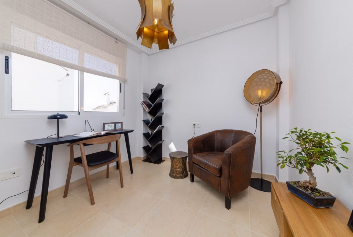 Bright, modern study area with sleek desk and leather chair in a key ready 3 bedroom villa in El Oasis, San Fulgencio