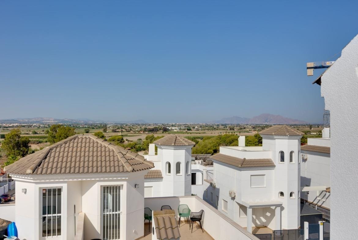Panoramic view of sun-drenched terrace and rooftops at key ready 3-bedroom villa in El Oasis, San Fulgencio