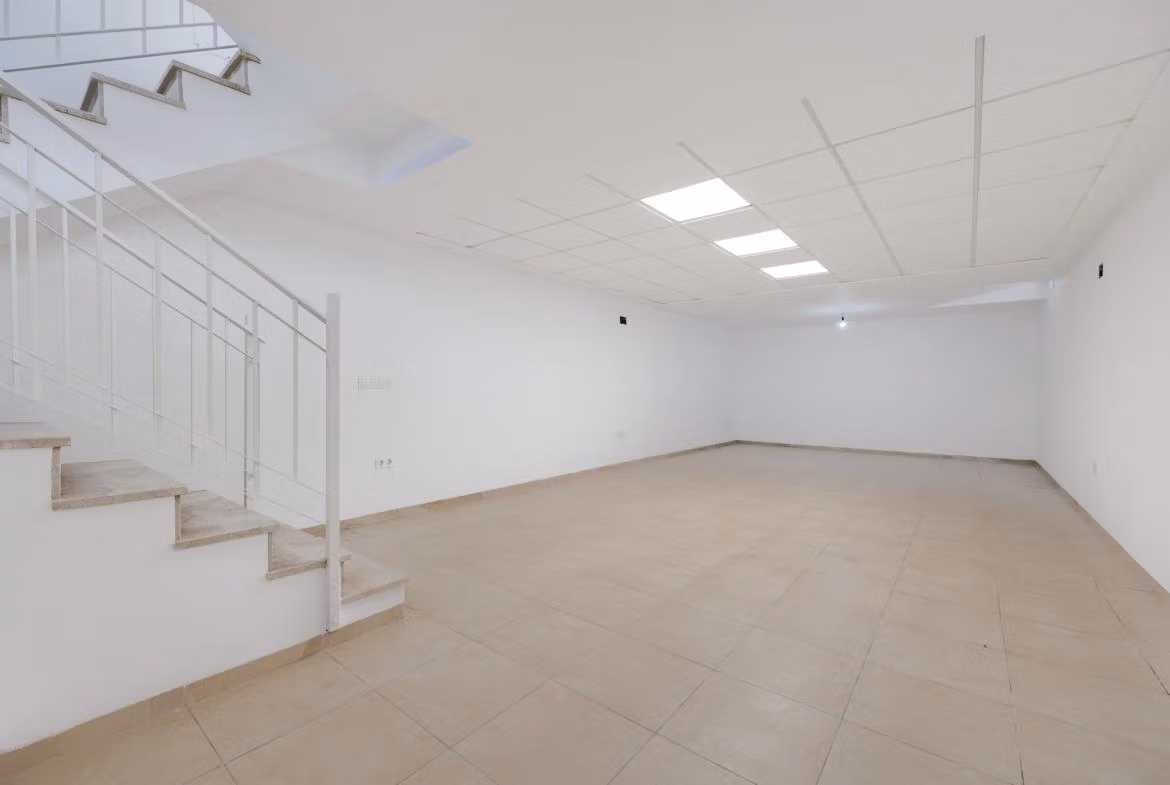 NEW-BUILD-RESIDENTIAL-IN-SAN-FULGENCIO-6 Bright spacious basement with modern staircase in 2 bedroom semi-detached villa in El Oasis La Marina Urbanisation