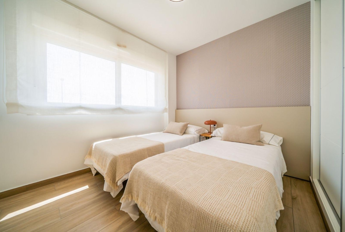 Bright modern twin bedroom with stylish decor in a 2-bedroom townhouse at Vistabella Golf, Orihuela