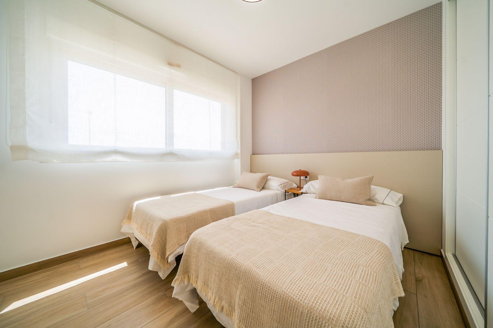 NEW-BUILD-RESIDENTIAL-OF-BUNGALOW-APARTMENTS-IN-VISTABELLA-21 Bright, modern two-bedroom top floor bungalow bedroom with soft natural light in Vistabella Golf, Orihuela.