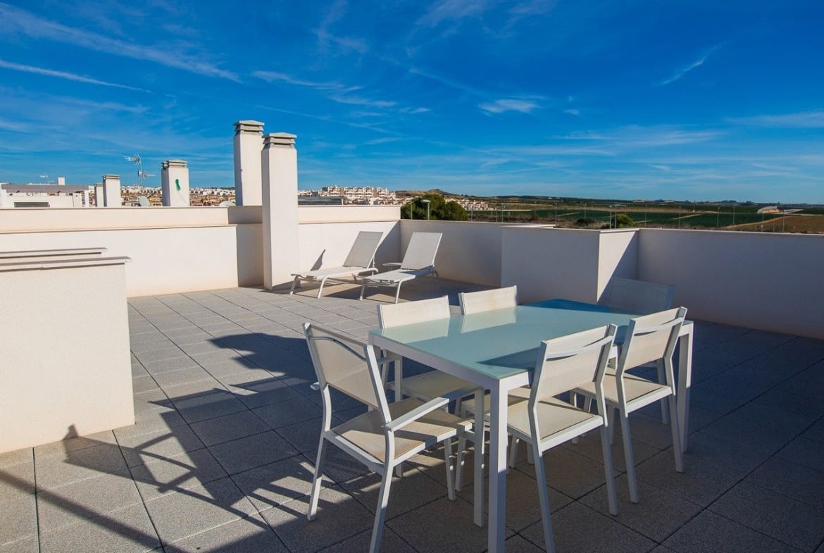 Sun-drenched spacious solarium with modern outdoor furniture atop 2-bedroom top floor apartment in Vistabella Golf, Orihuela.