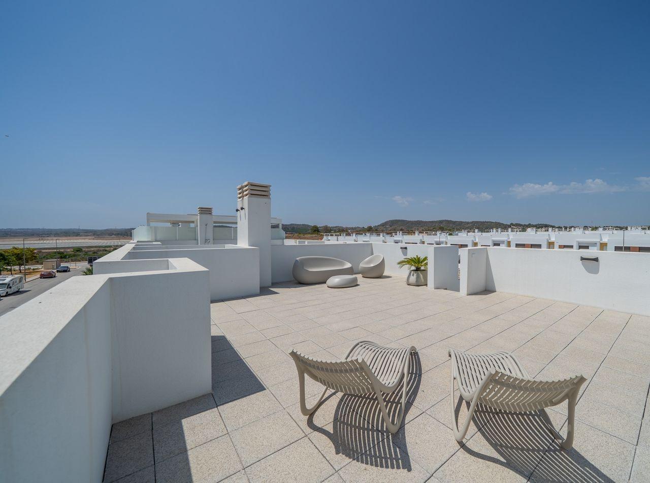 NEW-BUILD-RESIDENTIAL-OF-BUNGALOW-APARTMENTS-IN-VISTABELLA-31 Spacious sun-drenched solarium with modern seating on the top floor 2-bedroom bungalow in Vistabella Golf, Orihuela