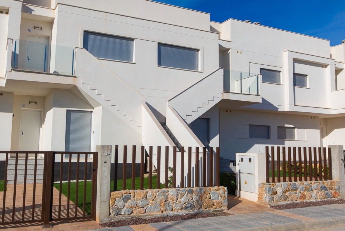 Modern sunlit top floor 2-bedroom apartment exterior with private solarium and landscaped garden in Vistabella Golf, Orihuela.