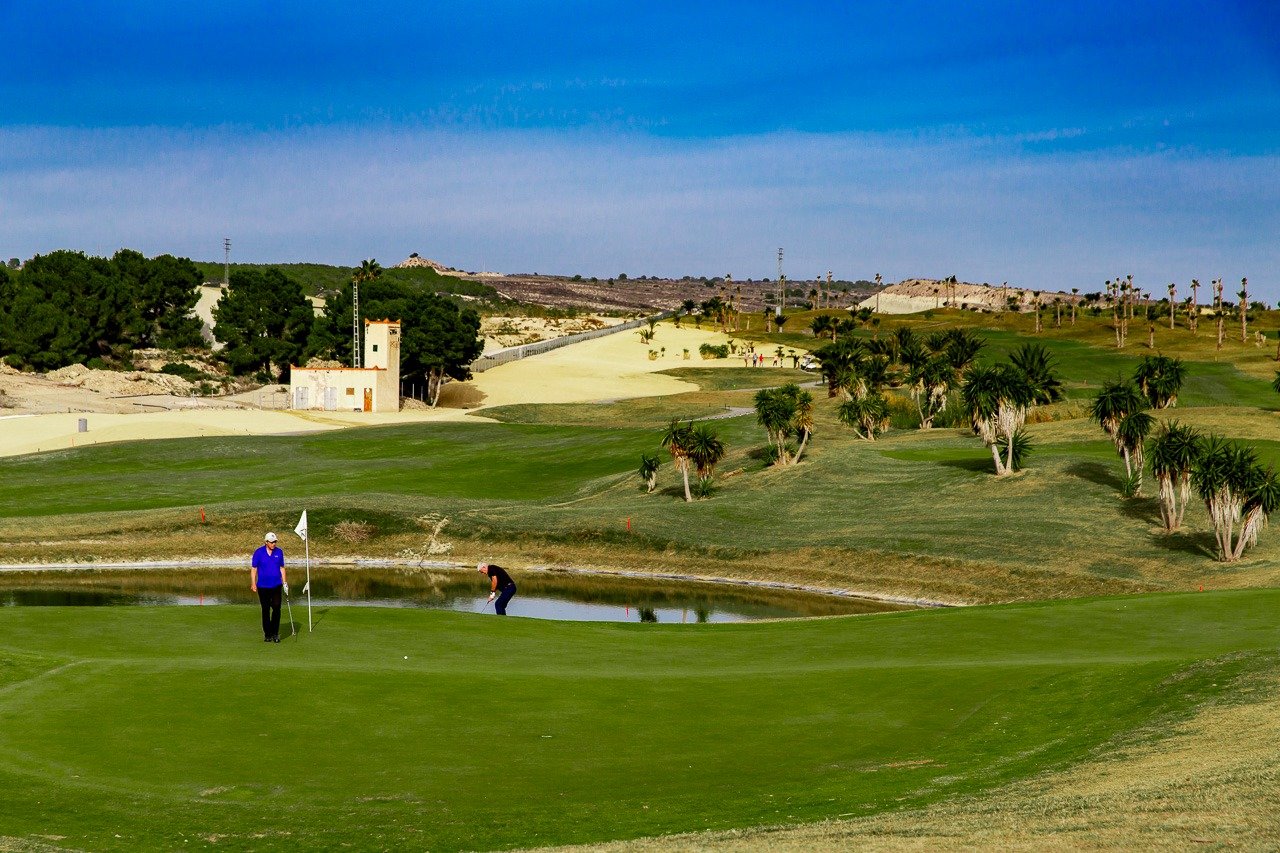 Sun-drenched, lush golf course with manicured greens at Vistabella Golf, ideal setting for 2 bedroom top floor apartment in Orihuela.
