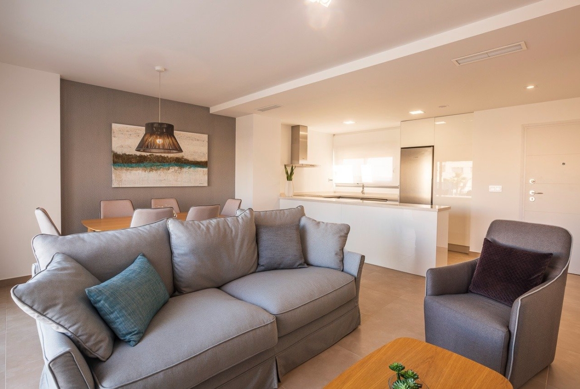 Bright and modern open-plan living area in a key ready 2 bedroom top floor apartment at Vistabella Golf, Orihuela.