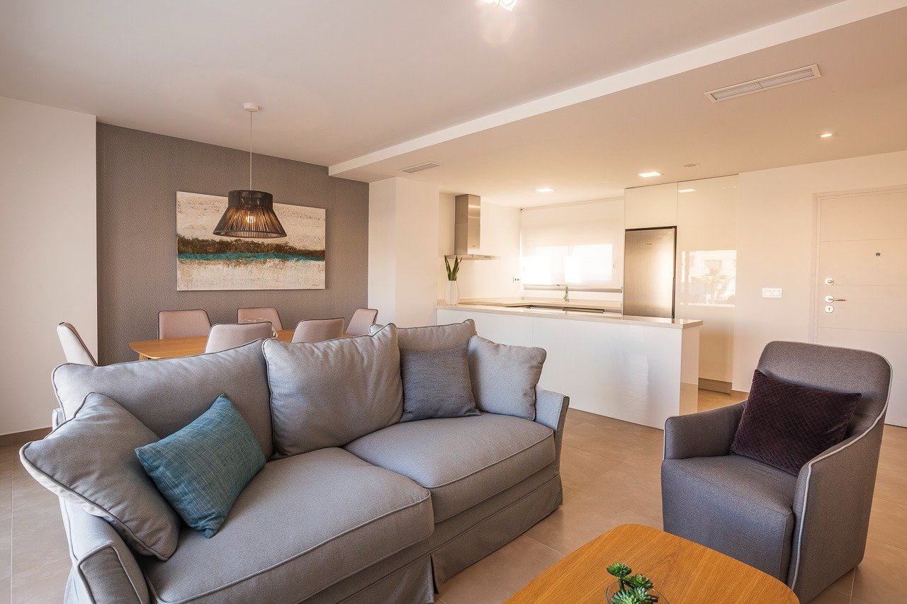 Bright and modern open-plan living area in a key ready 2 bedroom top floor apartment at Vistabella Golf, Orihuela.