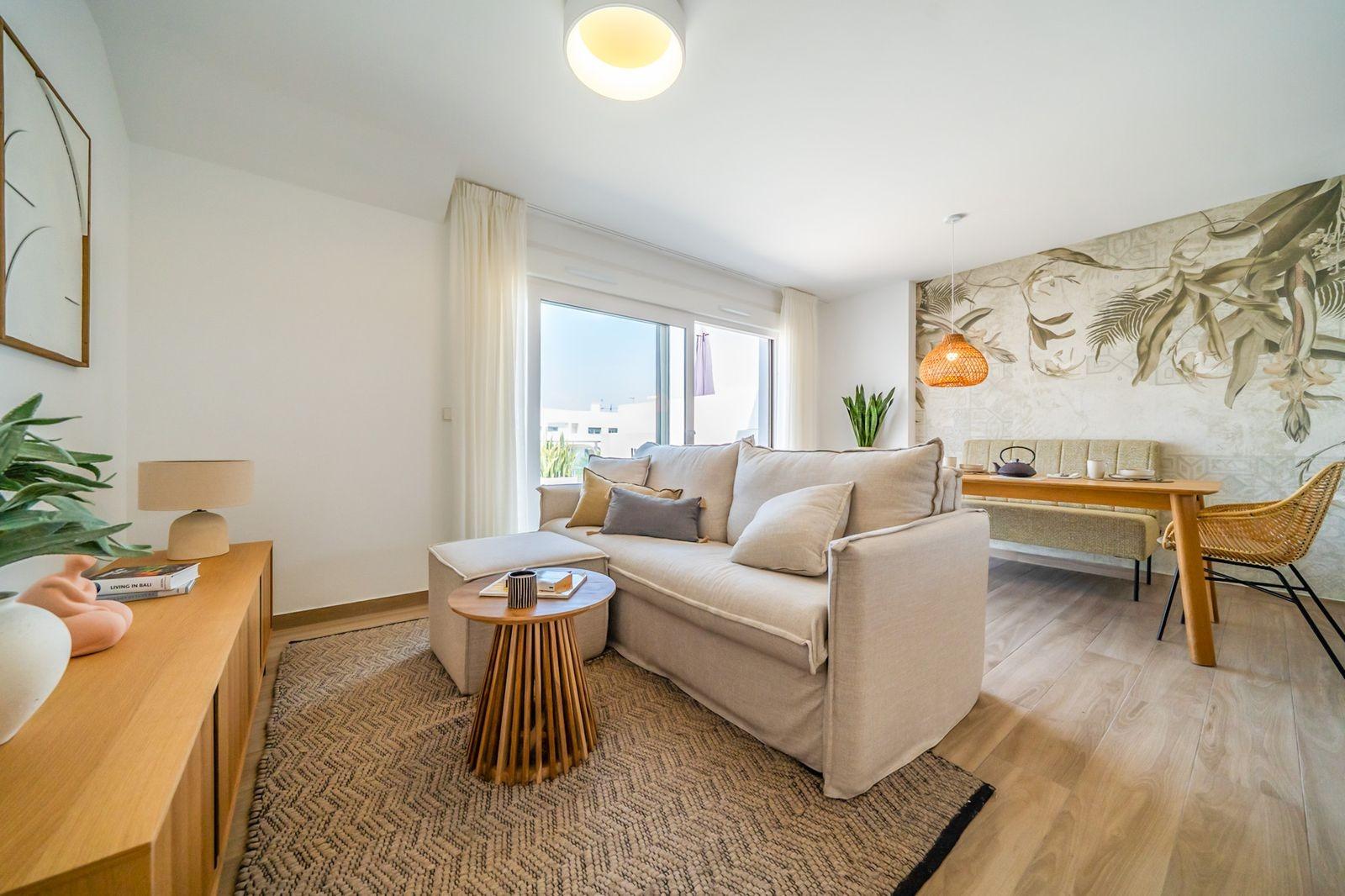 NEW-BUILD-RESIDENTIAL-OF-BUNGALOW-APARTMENTS-IN-VISTABELLA-7 Bright open-plan living area with modern furnishings in 2-bedroom top floor bungalow at Vistabella Golf, Orihuela.
