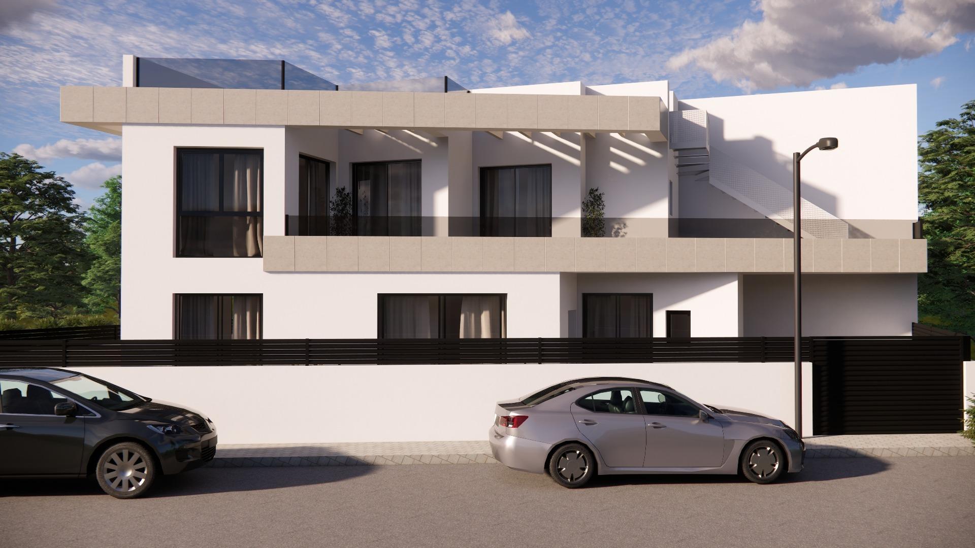 Sleek modern 3-bedroom townhouse in Rojales with bright facade, spacious terraces, and secure gated entrance visible from street view.