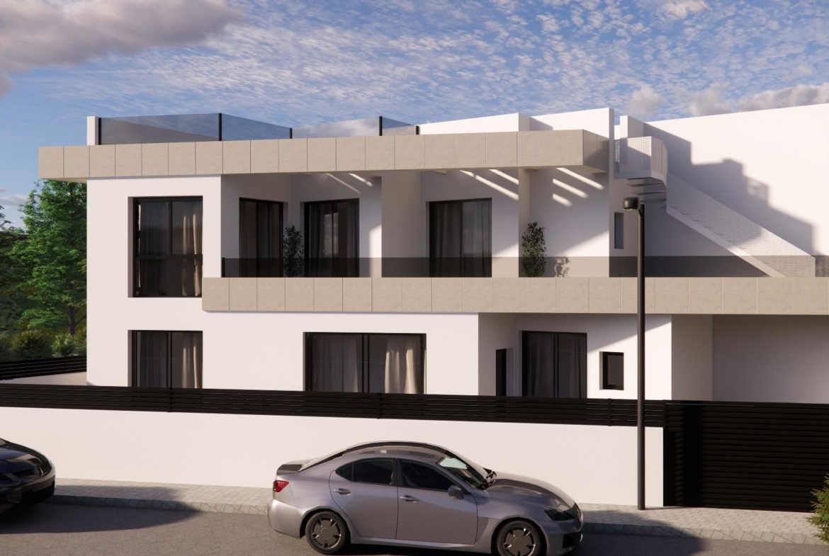 Modern new build 3-bedroom townhouse in Rojales with sleek white exterior, spacious balconies, and private parking.