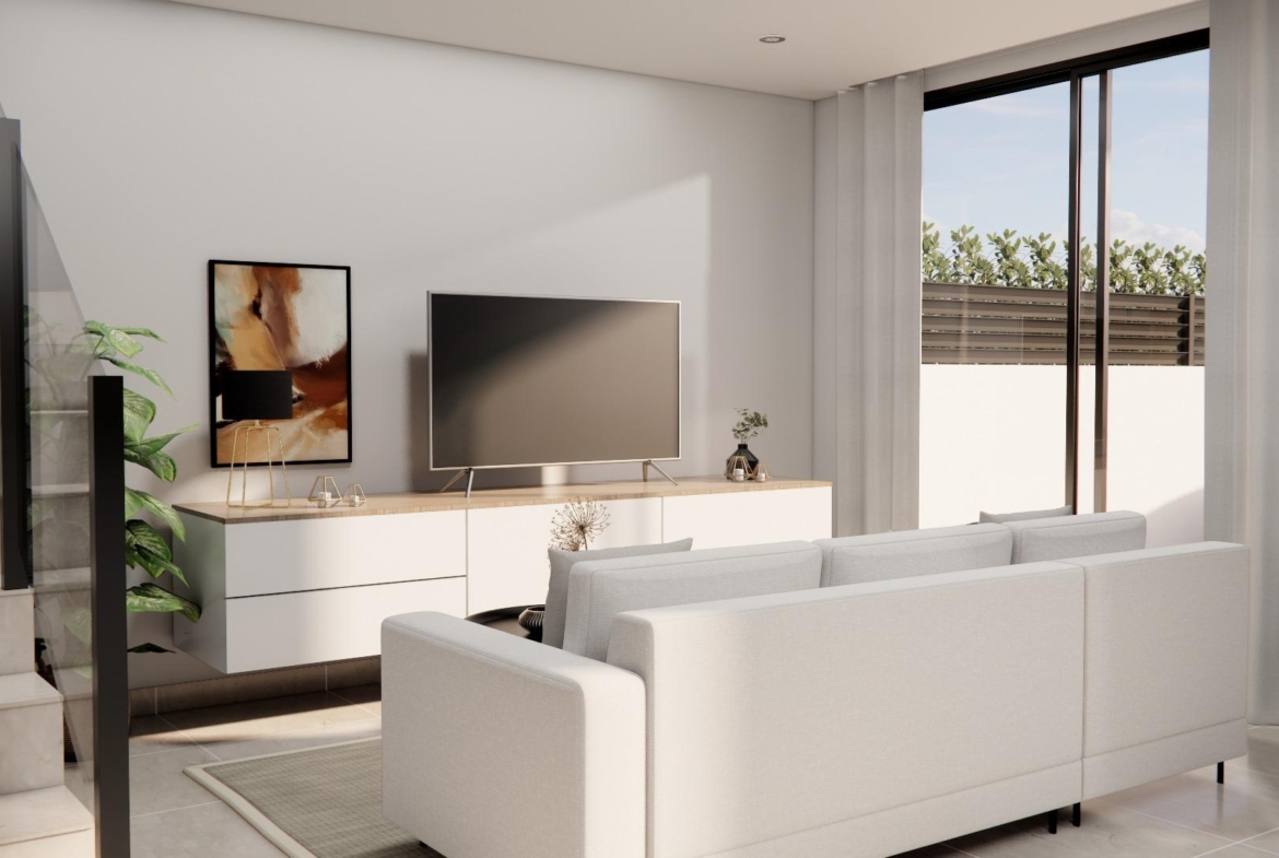 Bright modern living room with sleek white sofa and large sliding doors in luxury 3 bedroom townhouse in Rojales
