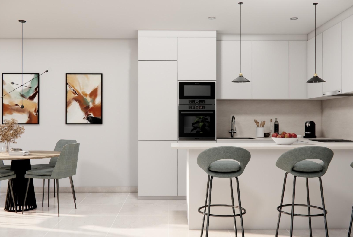 Bright modern open-plan kitchen and dining area in luxury 3 bedroom townhouse with private pool in Rojales.