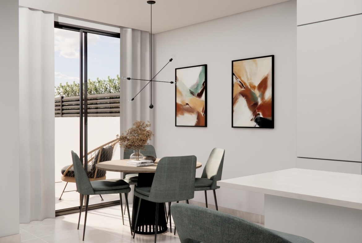 Bright modern dining area with sleek furniture and terrace access in luxury 3 bedroom townhouse in Rojales