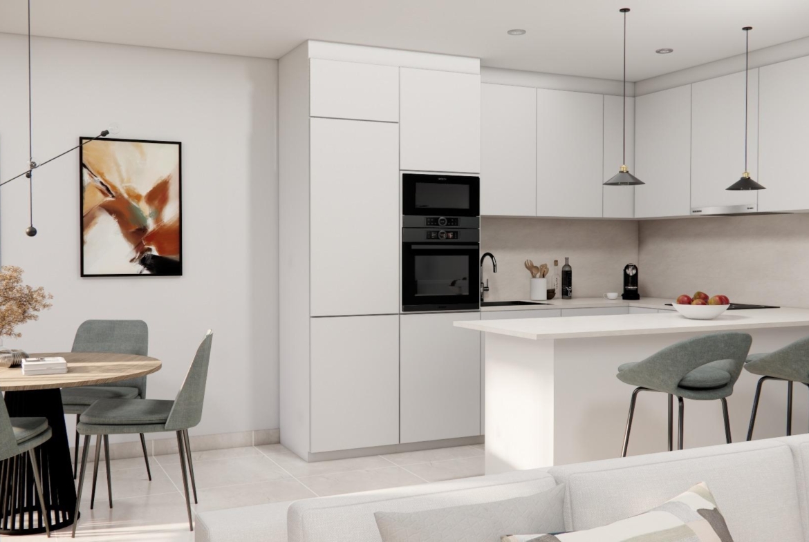 Bright modern open-plan kitchen and dining area in a luxury 3-bedroom townhouse with sleek design in Rojales.
