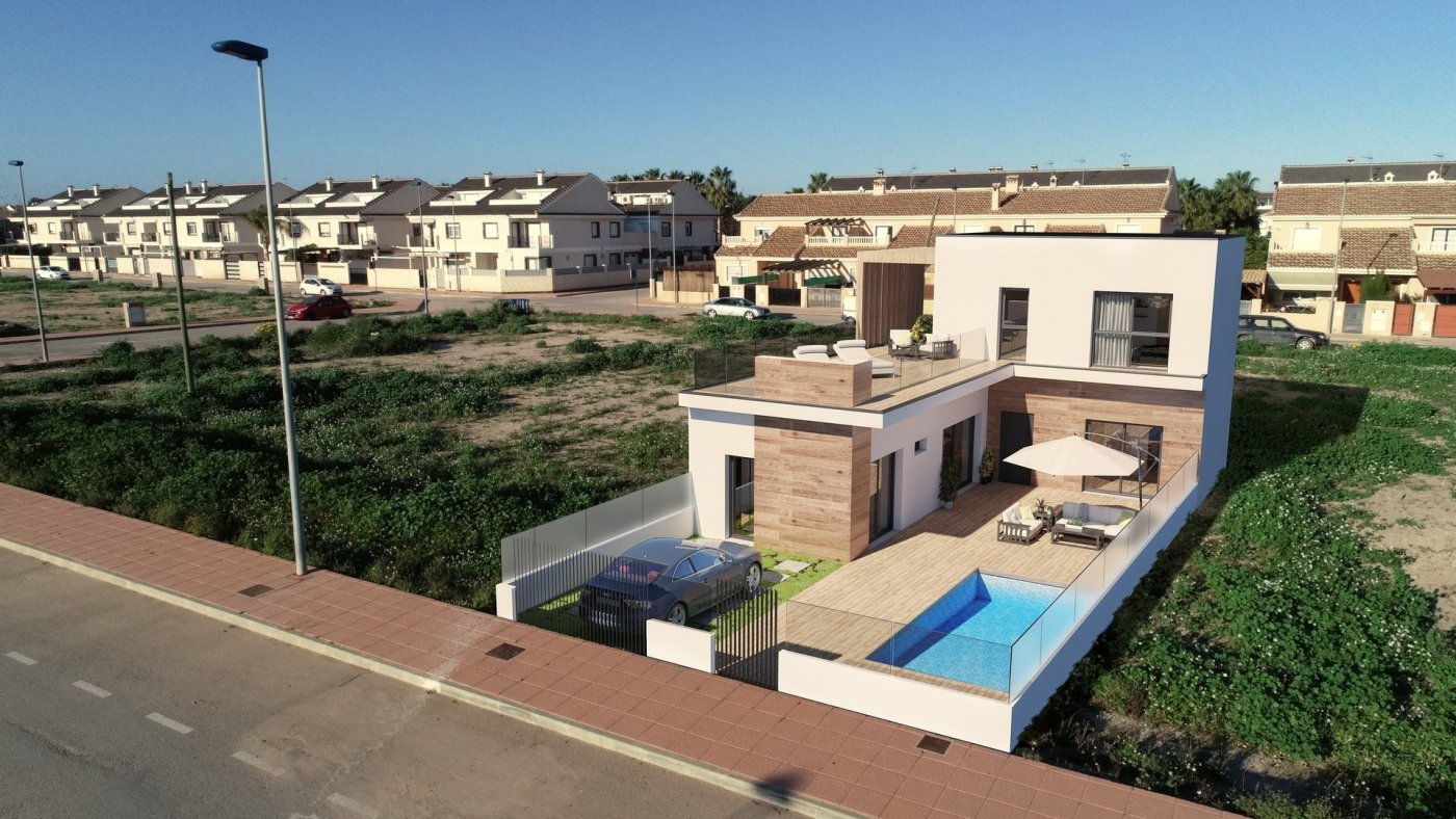 NEW-BUILD-TOWNHOUSES-IN-SAN-JAVIER-29 Modern luxury townhouse in San Javier featuring sun-drenched terrace, private pool, rooftop lounge, and sleek exterior design.