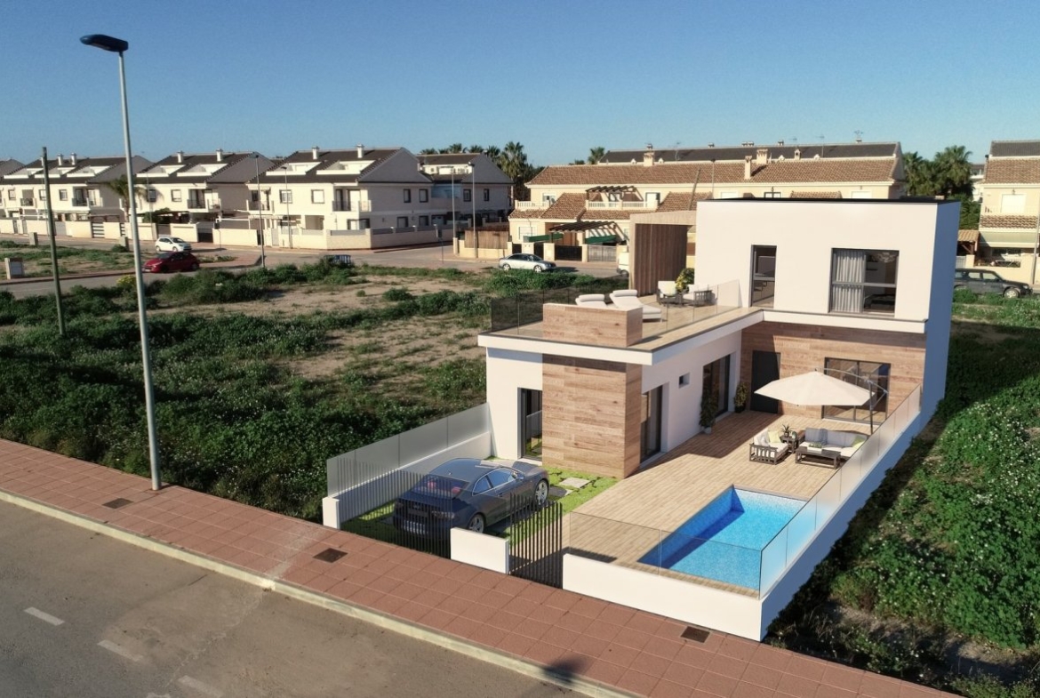 Modern luxury townhouse in San Javier featuring a sleek terrace, private pool, and stylish outdoor seating area.