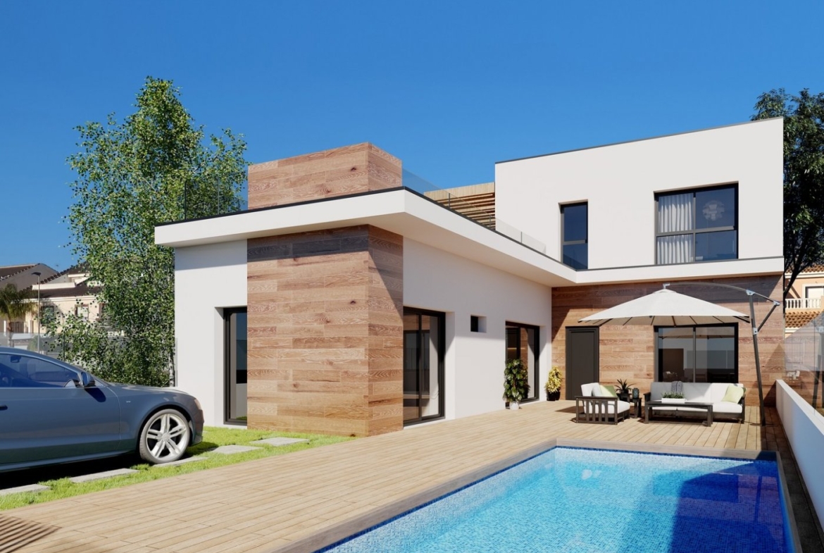 NEW BUILD TOWNHOUSES IN SAN JAVIER Modern luxury townhouse in San Javier featuring a sun-drenched poolside terrace with stylish wood accents and sleek white facade.